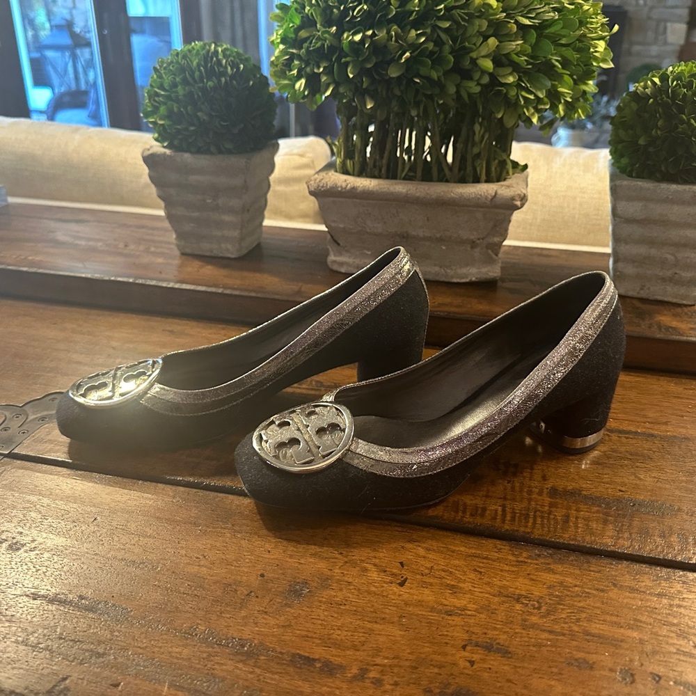 Tory Burch black 2 inch heels with silver accent.